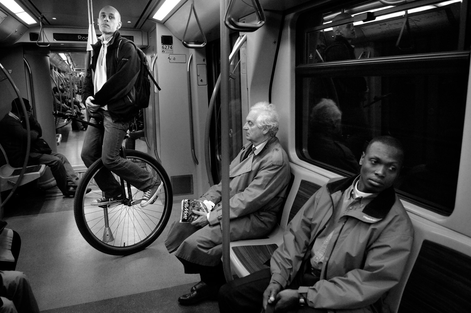 During one and a half year, I travelled with every bus, tram, and metro line at least once, from terminal to terminal.  Images and text show a cross-section of Brussels, while also  giving a brief glimpse into the lives of the) fellow passengers who cross our path every day. © Bram Penninckx